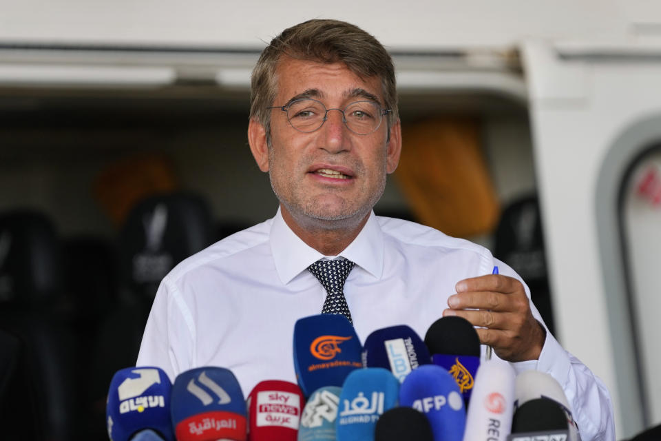 Lebanon's Energy Minister Walid Fayyad, speaks to reporters at the landing spot for helicopters that will fly to and from an offshore rig that arrived off the southern port city of Tyre near the border with Israel, at Beirut's Rafik Hariri International Airport, in Beirut, Lebanon, Wednesday, Aug. 16, 2023. An offshore drilling rig that will soon start activities in search for gas in the Mediterranean Sea off Lebanon's coast has arrived at its location and will start work in the coming weeks, Lebanese Cabinet ministers said Wednesday. (AP Photo/Hussein Malla)