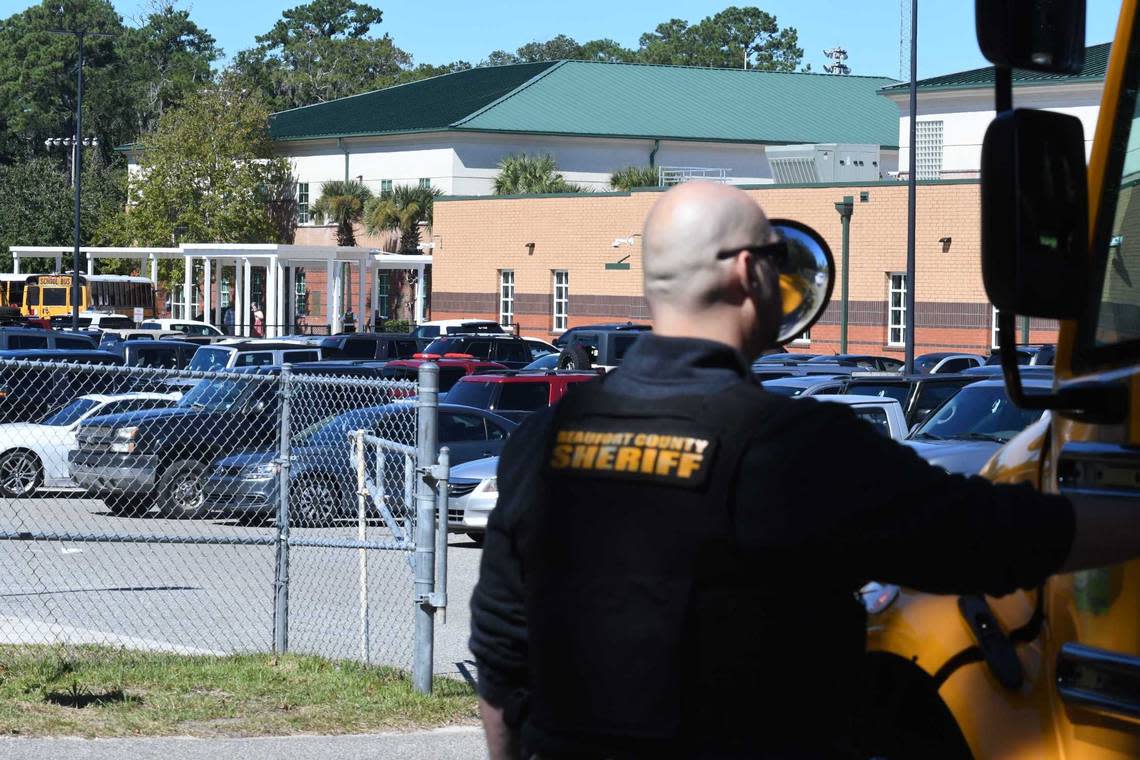 A Beaufort County Sheriff’s Office deputy tells a bus driver to pull up so other buses with Beaufort High School students can get through the intersection Wednesday.