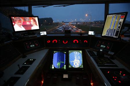 The bridge of the car transport ship "Tossa" is seen during its journey from a Ford plant in the German city of Cologne to the Dutch seaport of Vlissingen, as it enters a water-gate at Krammer in the Netherlands September 13, 2013. REUTERS/Wolfgang Rattay