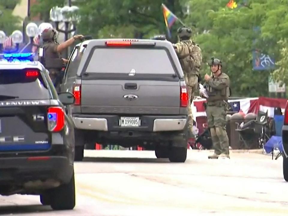 Police deploy after gunfire erupted at a Fourth of July parade route in the wealthy Chicago suburb of Highland Park, Illinois, U.S. July 4, 2022 in a still image from video. ABC affiliate WLS/ABC7