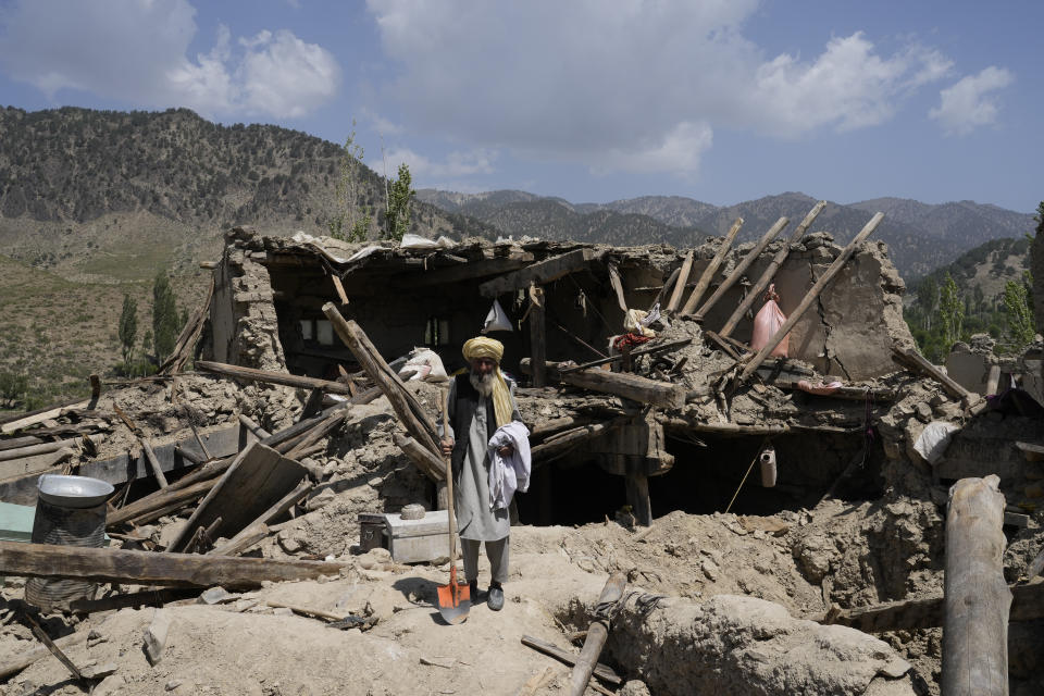 A man stands in front of his destroyed house after an earthquake in Gayan district in Paktika province, Afghanistan, Sunday, June 26, 2022. A powerful earthquake struck a rugged, mountainous region of eastern Afghanistan early Wednesday, flattening stone and mud-brick homes in the country's deadliest quake in two decades, the state-run news agency reported. (AP Photo/Ebrahim Nooroozi)