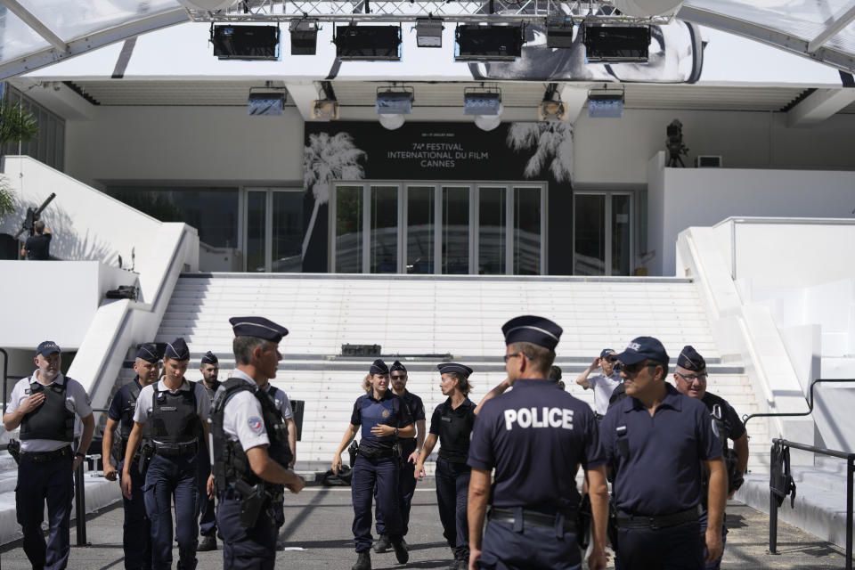 Members of the police are seen in front of the entrance to the Palais des Festival prior to the 74th international film festival, Cannes, southern France, July 5, 2021. The Cannes film festival runs from July 6 - July 17. (AP Photo/ Vadim Ghirda)