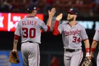 Aug 16, 2018; St. Louis, MO, USA; Washington Nationals center fielder Bryce Harper (34) celebrates with relief pitcher Koda Glover (30) after the Nationals defeated the St. Louis Cardinals at Busch Stadium. Jeff Curry-USA TODAY Sports