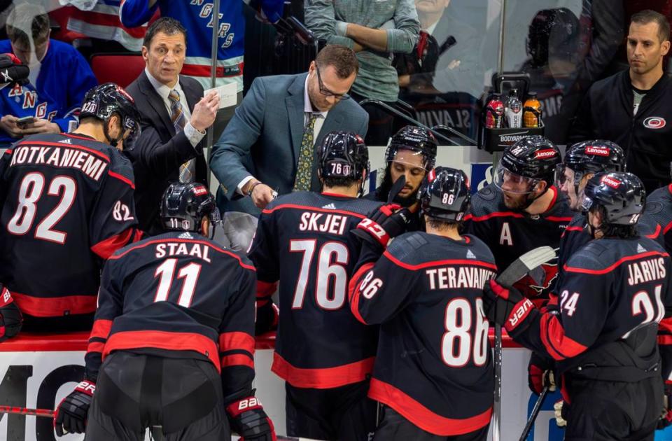 Carolina Hurricanes coach Rod Brind’Amour and assistant coach Tim Gleason work with their players as the New York Ranges pull their goalie in the closing minute of play in Game 4 during the second round of the 2024 Stanley Cup playoffs on Saturday, May 11, 2024 at PNC Arena, in Raleigh N.C.