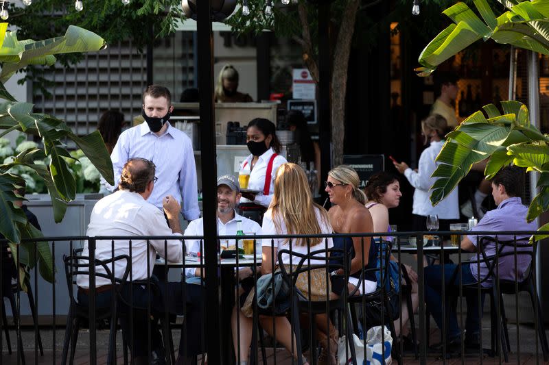 People go out to eat at crowded restaurants in Birmingham, Michigan