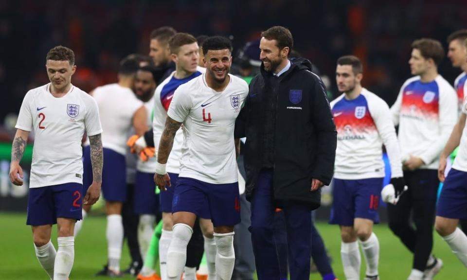 Gareth Southgate, centre, congratulates his players at full-time in Holland.