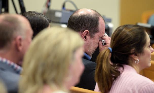 PHOTO: David Wheeler wipes away tears as attorney Chris Mattei shows a photograph of his family, including son Ben, during his closing statements in the Alex Jones Sandy Hook defamation damages trial in Superior Court in Waterbury, Conn., Oct. 6, 2022.  (Hearst Connecticut Media/Pool via Reuters)