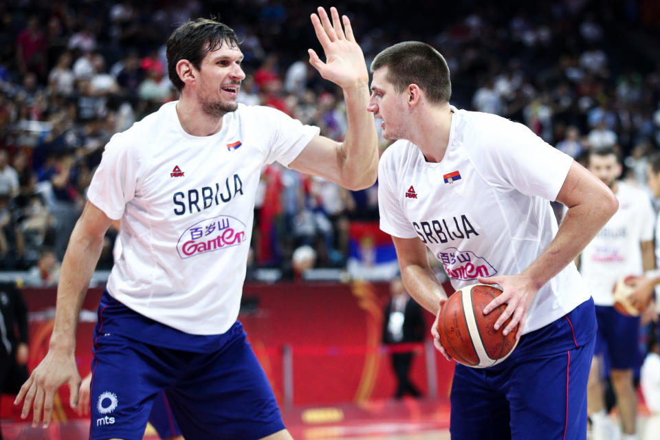 FOSHAN, CHINA - SEPTEMBER 04: #15 Nikola Jokic and #51 Boban Marjanovic of the Serbia National Team warm up before the match against the Italy National Team during the 1st round of 2019 FIBA World Cup at GBA International Sports and Cultural Center on September 4, 2019 in Foshan, China. (Photo by Zhong Zhi/Getty Images)