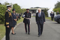 Britain's Prime Minister Boris Johnson arrives to attend the national service of remembrance marking the 75th anniversary of VJ Day at the National Memorial Arboretum in Alrewas, England, Saturday Aug. 15, 2020. Boris Johnson paid tribute to surviving veterans of the multinational campaign against Japan in World War II, which ended 75 years ago, noting the veterans courage during the six-year campaign that cost the lives of some 50,000 troops. (Peter Byrne/PA via AP)