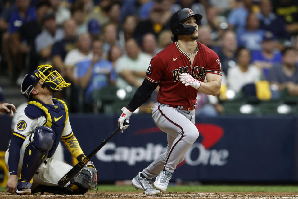 Oct 4, 2023; Milwaukee, Wisconsin, USA; Arizona Diamondbacks center fielder Alek Thomas (5) hits a home run in the fifth inning against the Milwaukee Brewers during game two of the Wildcard series for the 2023 MLB playoffs at American Family Field. Mandatory Credit: Kamil Krzaczynski-USA TODAY Sports