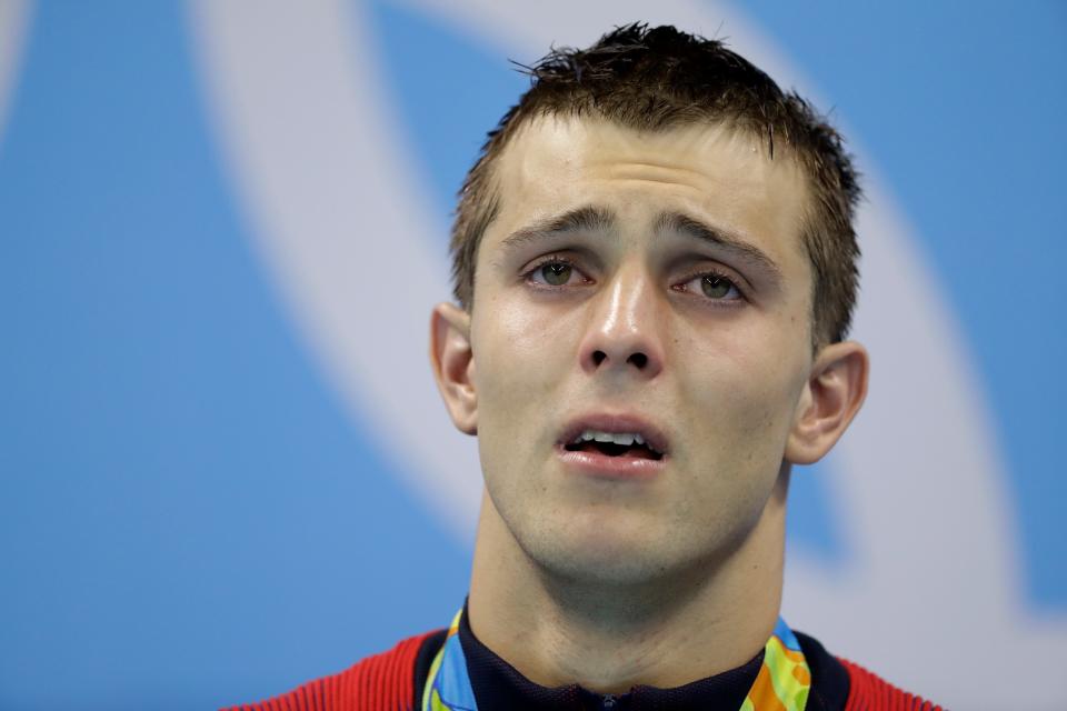 United States' gold medal winner Ryan Held cries during the medal ceremony for the men's 4x100-meter freestyle relay final at the swimming competitions at the 2016 Summer Olympics, Monday, Aug. 8, 2016, in Rio de Janeiro, Brazil. (AP Photo/Michael Sohn)