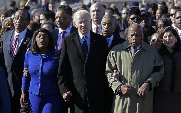 Vice President Joe Biden leads a group across the Edmund Pettus Bridge in Selma, Ala., on March 3, 2013. From left, Selma Mayor George Evans; Rep. Terri Sewell, D-Ala.; Jesse Jackson; Al Sharpton; and Rep. John Lewis, D-Ga.