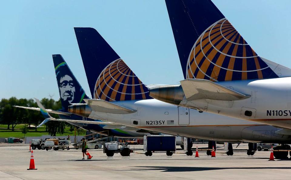 Passenger jet planes sit on the tarmac at the Tri-Cities Airport as they prepare to depart from Pasco.