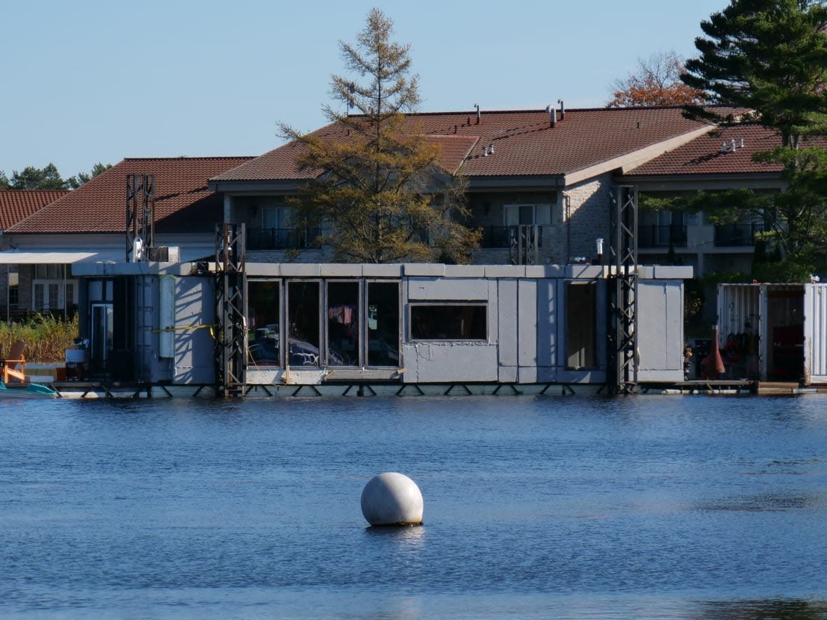 Joe Nimens' floating home, made of two shipping containers, pictured at Severn marina. Nimens started building it two years ago as a prototype. (Alexis Raymon/CBC News - image credit)