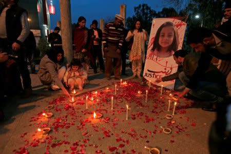 FILE PHOTO: Members of Civil Society light candles and earthen lamps to condemn the rape and murder of 7-year-old girl Zainab Ansari in Kasur, during a candlelight vigil in Islamabad, Pakistan January 11, 2018. REUTERS/Faisal Mahmood/File Photo