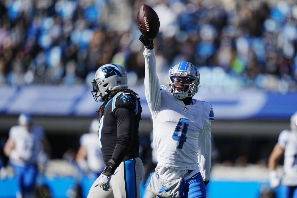Detroit Lions wide receiver DJ Chark makes a catch over Carolina Panthers safety Jeremy Chinn during the first half of an NFL football game between the Carolina Panthers and the Detroit Lions on Saturday, Dec. 24, 2022, in Charlotte, N.C. (AP Photo/Rusty Jones)