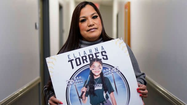 PHOTO: Sandra Torres, holds a photo of her daughter Eliahna, who was one of 19 students and two teachers killed in the school shooting in Uvalde, Texas, at her attorney's office, Monday, Nov. 28, 2022, in San Antonio. (Eric Gay/AP)