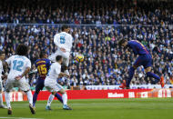 <p>Barcelona’s Gerard Pique, right, attempts a header at goal during the Spanish La Liga soccer match between Real Madrid and Barcelona at the Santiago Bernabeu stadium in Madrid, Spain, Saturday, Dec. 23, 2017. (AP Photo/Francisco Seco) </p>