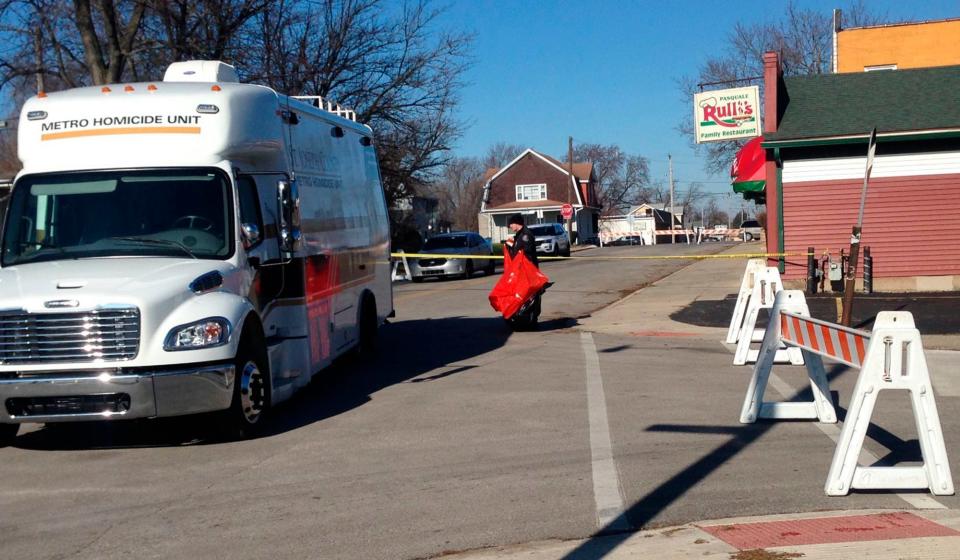 In this Sunday, Dec. 9, 2018 photo, police investigate after the body of a pregnant teenager was found in a dumpster behind a Mishawaka, Ind., restaurant. Authorities say a 16-year-old boy is suspected in the death of a 17-year-old pregnant schoolmate and was arrested Sunday. (Joseph Dits/South Bend Tribune via AP)