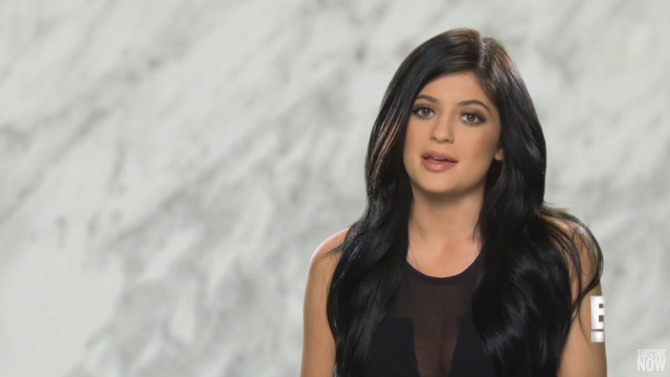 An interview shot of Kylie on 'Keeping Up' speaking to the camera in front of a marble background