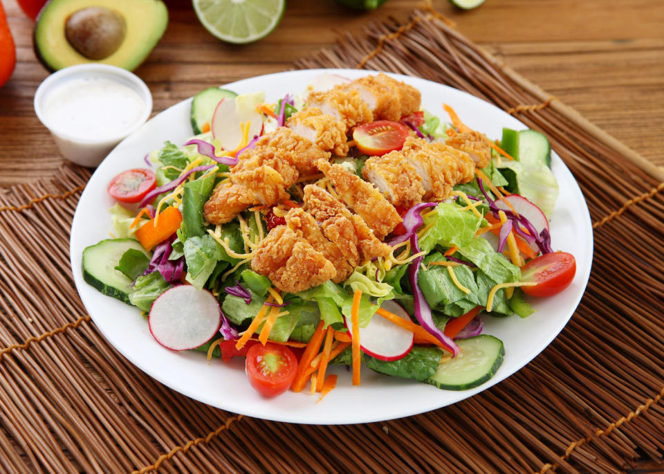 Try subbing grilled chicken or even a burger patty for fried chicken to get healthier protein. (whitewish via Getty Images)