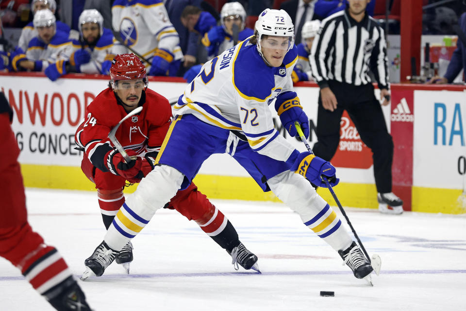 Buffalo Sabres' Tage Thompson (72) controls the puck in front of Carolina Hurricanes' Seth Jarvis (24) during the first period of an NHL hockey game in Raleigh, N.C., Tuesday, Nov. 7, 2023. (AP Photo/Karl B DeBlaker)