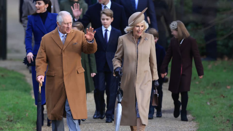 The royal family greet crowds as they walk to Christmas Morning Service in the grounds of Sandringham, a sprawling 20,000-acre estate around 100 miles north of London, on Monday. - Stephen Pond/Getty Images