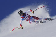 Switzerland's Lara Gut-Behrami speeds down the course during an alpine ski an alpine ski, women's World Cup super-G in St. Moritz, Switzerland, Sunday, Dec. 12, 2021. (AP Photo/Marco Tacca)