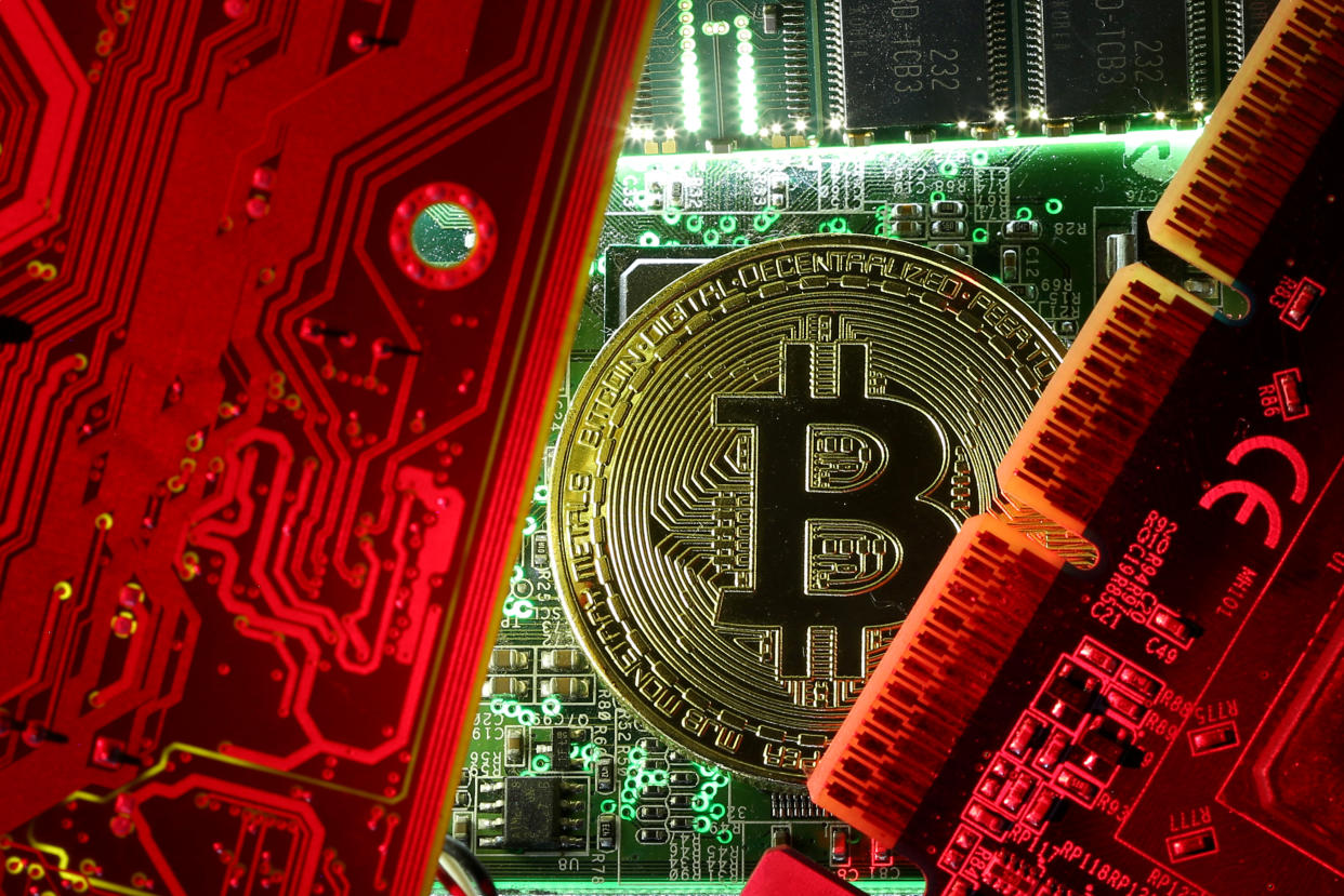 A copy of bitcoin standing on PC motherboard is seen in this illustration picture, October 26, 2017. REUTERS/Dado Ruvic/File Photo