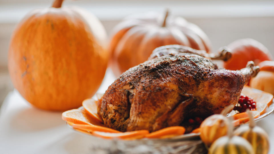 Close-Up Of Roast Turkey With Orange Slices In Plate on thanksgiving dinner.