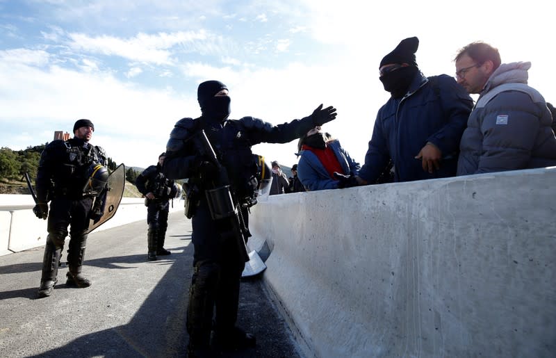 Members of Catalan protest group Democratic Tsunami block AP-7 highway on the French side of the Spanish-French border