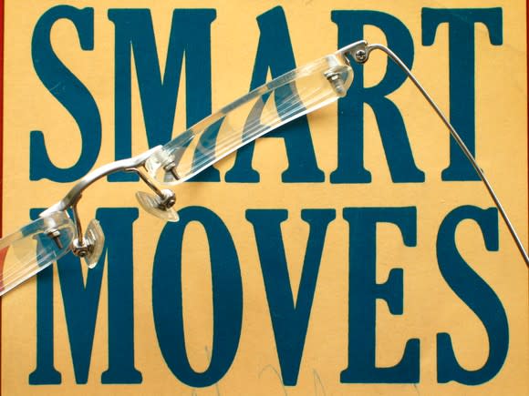 The words "SMART MOVES" printed on a yellow background, with a pair of eyeglasses sitting on top