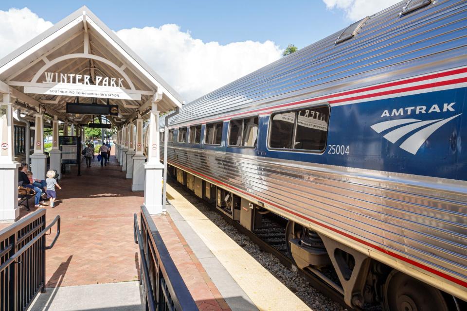 Florida, Orlando, Amtrak, Sunrail Station, departing train from station platform.