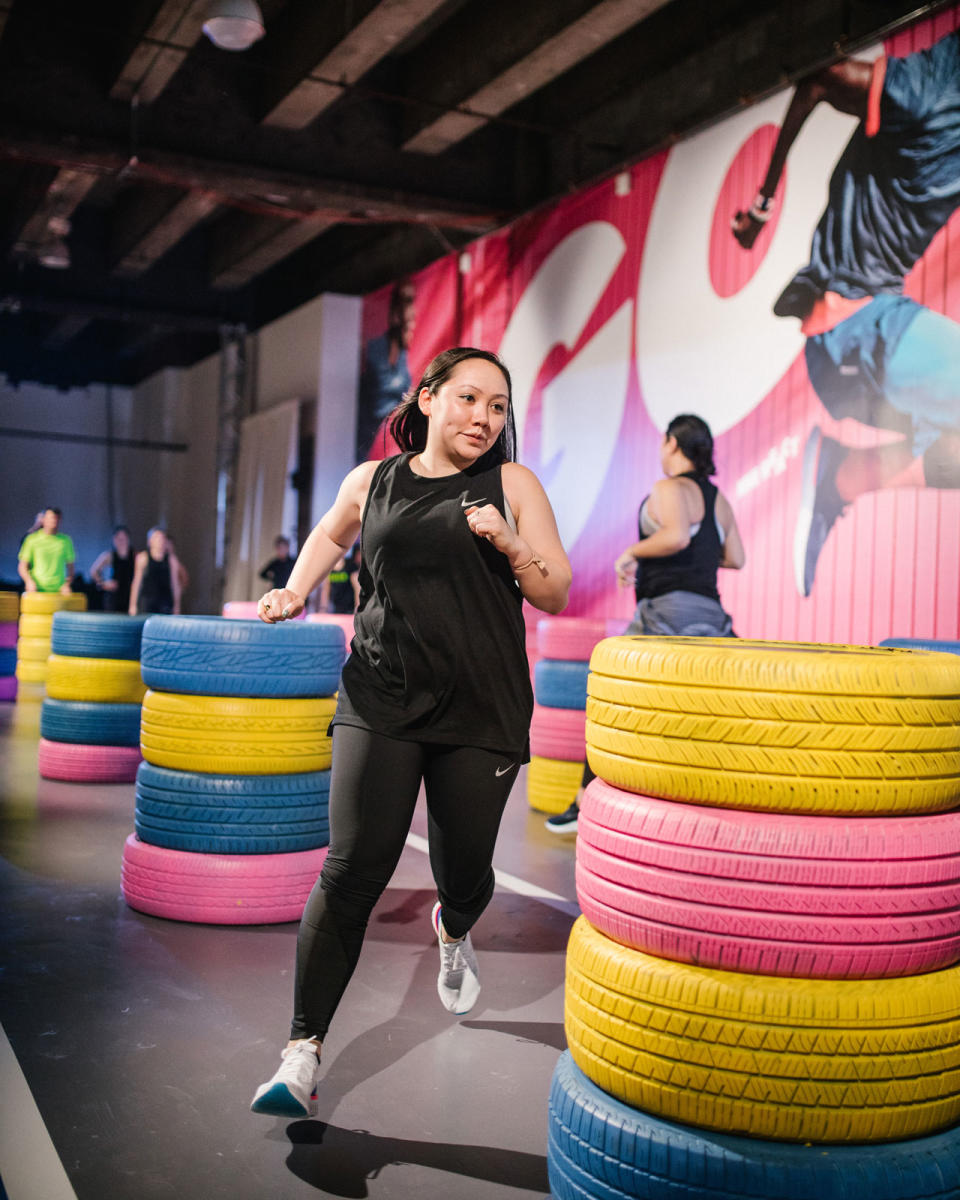 Yahoo’s Lifestyle fashion editor, Julie Tong, tests out the Epic React Flyknits at the Nike press preview event. (Photo: Courtesy of Nike)