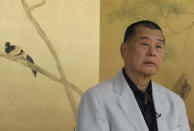 Hong Kong media tycoon Jimmy Lai pauses during an interview Hong Kong Wednesday, July 1, 2020. Lai said in an interview Wednesday that Hong Kong is dead under the new national security law. Lai, who owns popular newspaper Apple Daily, is a prominent advocate for democracy in Hong Kong. (AP Photo/Vincent Yu)