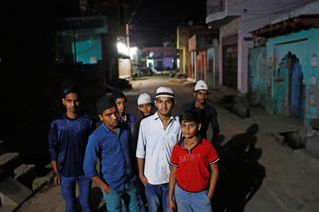 FILE PHOTO: Muslim children stand outside a mosque as they arrive to offer their morning prayer during the holy month of Ramadan in village Nayabans in the northern state of Uttar Pradesh, India May 10, 2019. REUTERS/Adnan Abidi