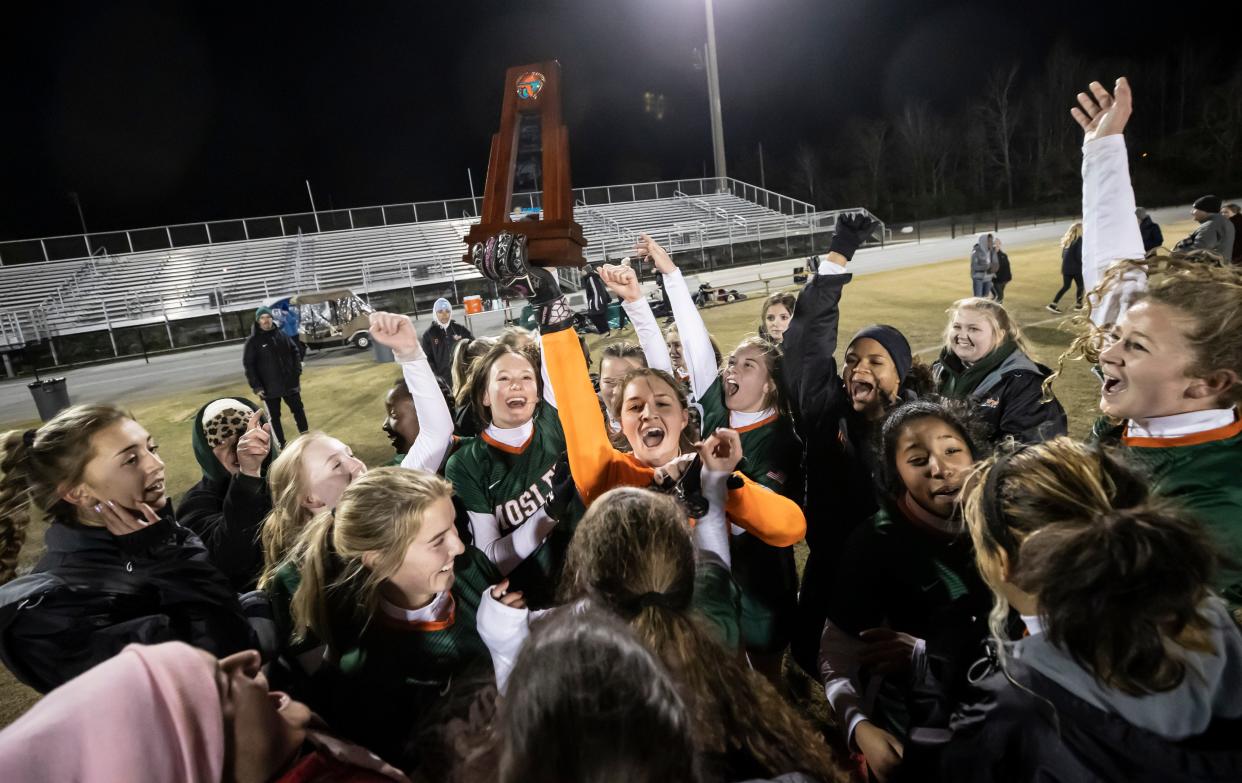 The Dolphins celebrate their overtime win over Arnold. Mosley and Arnold faced off at Gavlak Stadium in the District 2-5A final with the Dolphins coming out on top 2-1 in overtime.
