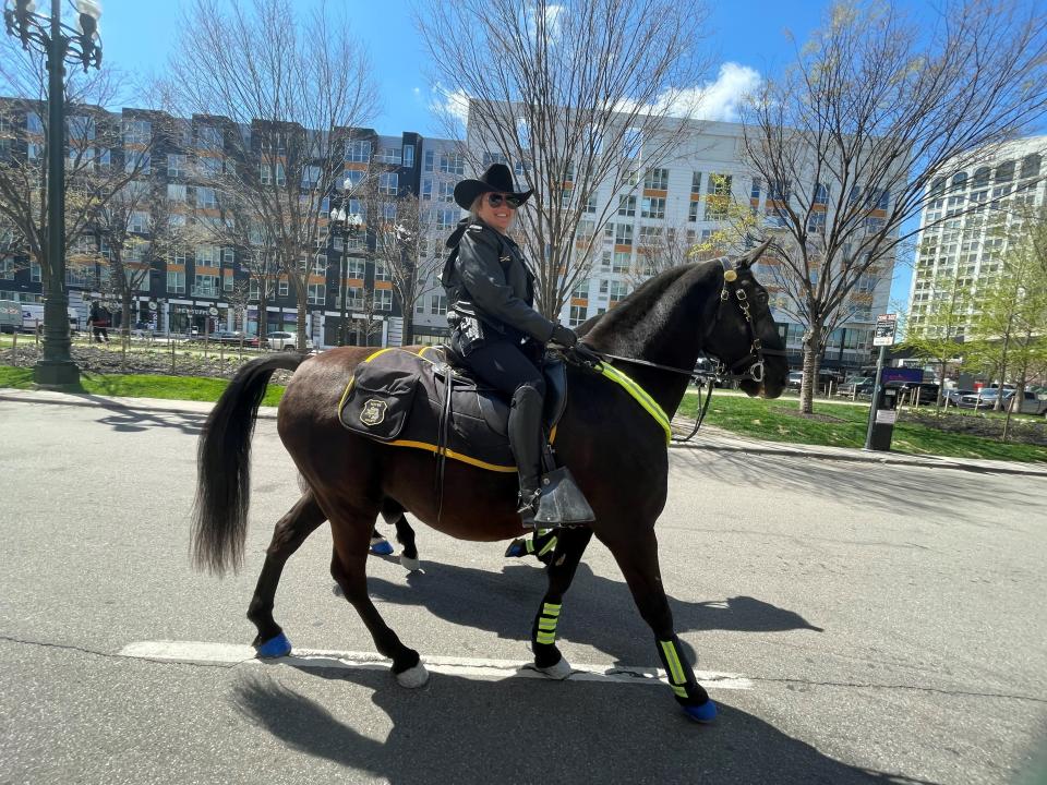 Wayne County Sheriff's Office Sgt. Lacey Polderdyke rides Hogan in Detroit during the NFL draft on Thursday, April, 25, 2024.