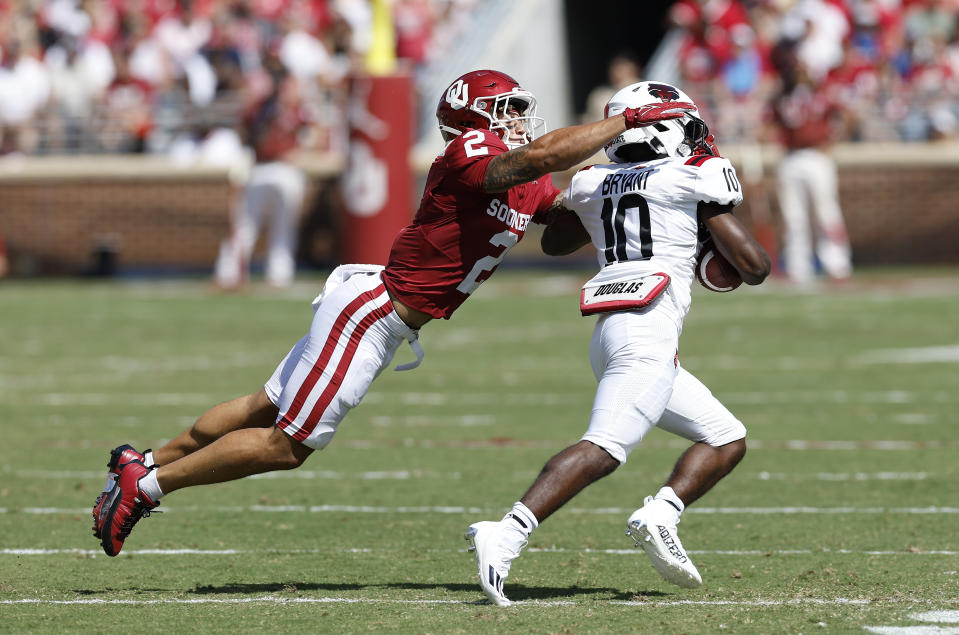 Oklahoma defensive back Billy Bowman Jr. (2) tackles Arkansas State wide receiver Tennel Bryant (10) during the first half of an NCAA college football game, Saturday, Sept. 2, 2023, in Norman, Okla. (AP Photo/Alonzo Adams)