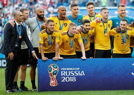 Soccer Football - World Cup - Third Place Play Off - Belgium v England - Saint Petersburg Stadium, Saint Petersburg, Russia - July 14, 2018 Belgium coach Roberto Martinez, assistant coach Thierry Henry, Eden Hazard and team mates celebrate with their medals after the match REUTERS/Toru Hanai