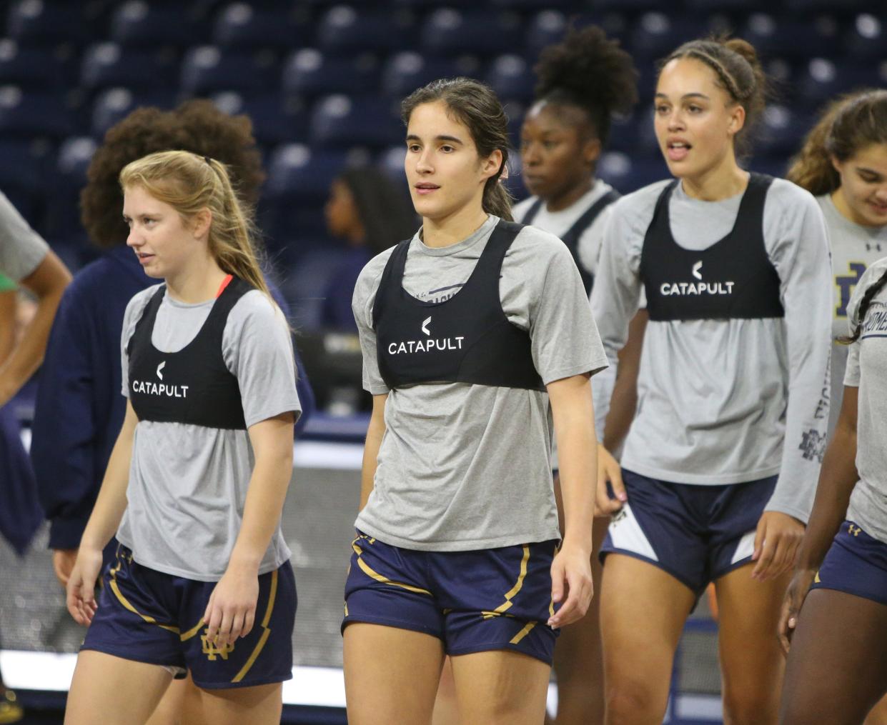 Notre Dame players Anna DeWolfe, Sonia Citron and Natalija Marshall walk at practice Tuesday, Oct. 10, 2023, at the Notre Dame women’s basketball media day at Purcell Pavilion on South Bend.