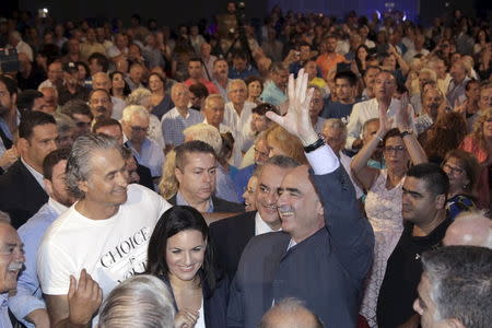 Leader of New Democracy conservative party Evangelos Meimarakis waves to party supporters before his speech at a pre-election rally at the city of Heraklion on the Greek island of Crete, September 2, 2015. Greek leftist Syriza party on Wednesday fell behind its main conservative rivals for the first time since former premier Alexis Tsipras resigned, offering further evidence that his decision to call a snap election could backfire. REUTERS/Stefanos Rapanis