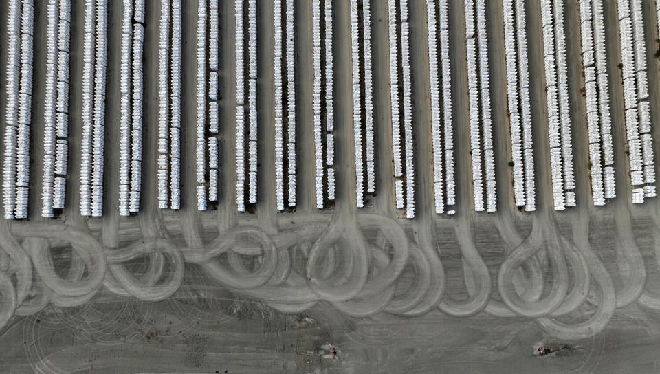 An aerial view of J.G. Boswell Co. cotton bales stored on a large lot.