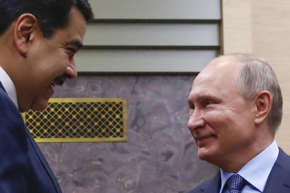 FILE - In this Dec. 5, 2018 file photo, Venezuelan President Nicolas Maduro, left, and Russian President Vladimir Putin greet each other outside the Novo-Ogaryovo residence in Moscow, Russia. Russia is an ally of the Venezuelan president, who is under challenge from opposition leader Juan Guaido in a resurgence of the country’s political crisis after declaring presidential authority and vowing to oust the socialist leader. (Maxim Shemetov/Pool Photo via AP File)