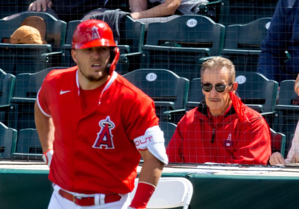 Arte Moreno and Mike Trout during a spring training game in 2021.