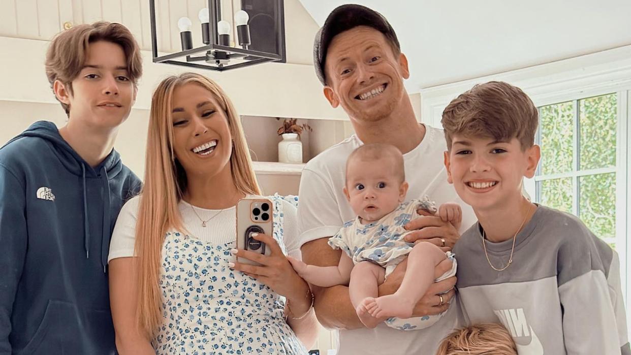 Stacey in selfie with Joe and five kids