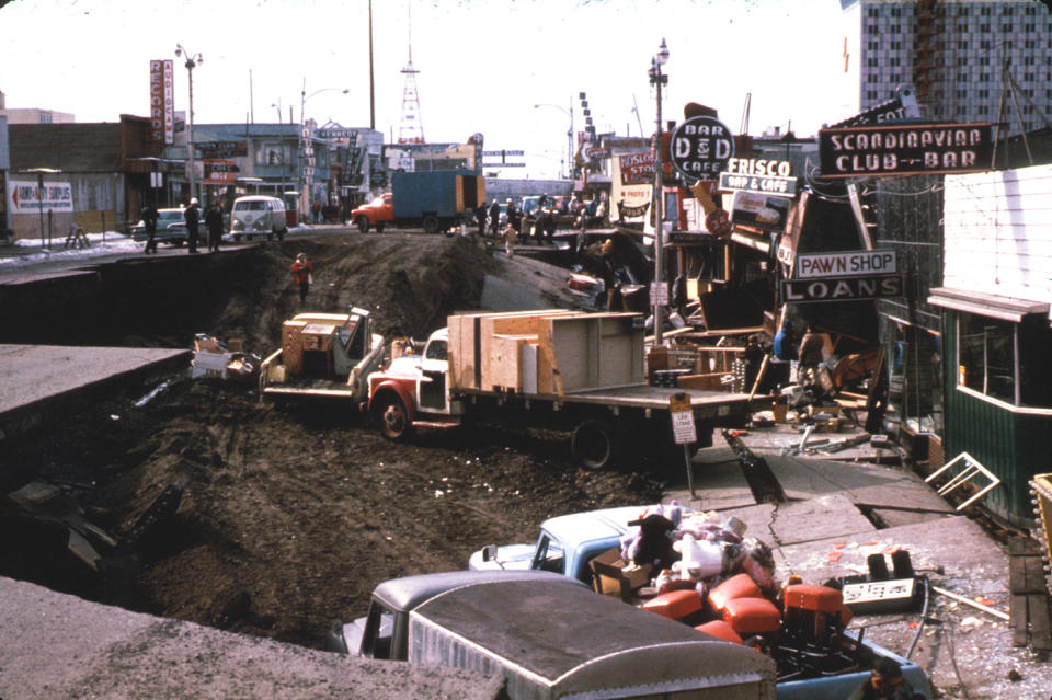 In this March 1964 photo released by the U.S. Geological Survey, Anchorage small business owners clear salvagable items and equipment from their earthquake-ravaged stores on shattered Fourth Avenue in Alaska in the aftermath of an earthquake. North America's largest earthquake rattled Alaska 50 years ago, killing 15 people and creating a tsunami that killed 124 more from Alaska to California. The magnitude 9.2 quake hit at 5:30 p.m. on Good Friday, turning soil beneath parts of Anchorage into jelly and collapsing buildings that were not engineered to withstand the force of colliding continental plates. (AP Photo/U.S. Geological Survey)