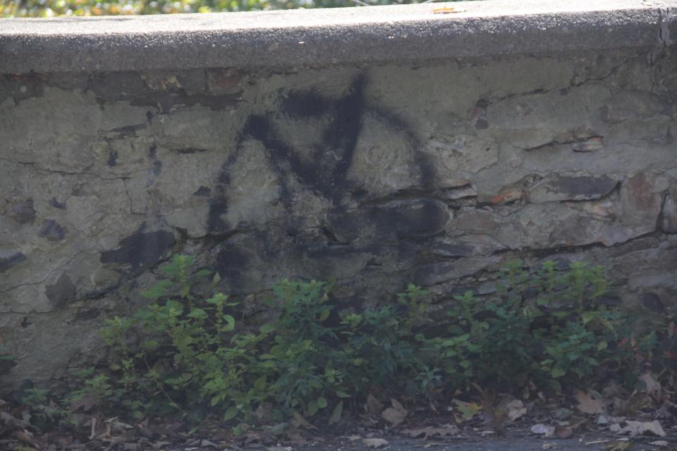 A pentagram spray painted onto a wall at Clinton Road.