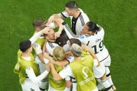 Germany's Niclas Fuellkrug, top centre, celebrates with teammates after scoring his side's first goal during the World Cup group E soccer match between Spain and Germany, at the Al Bayt Stadium in Al Khor , Qatar, Sunday, Nov. 27, 2022. (AP Photo/Petr David Josek)