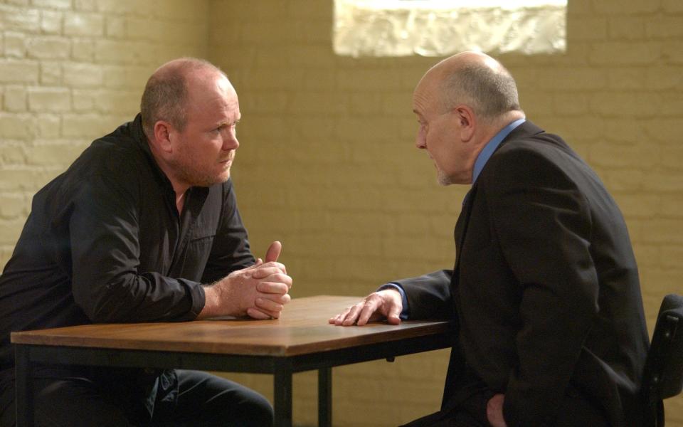 Churchett as Marcus Christie visiting his client Phil Mitchell (Steve McFadden) in prison in a 2003 episode of EastEnders - Adam Pensotti